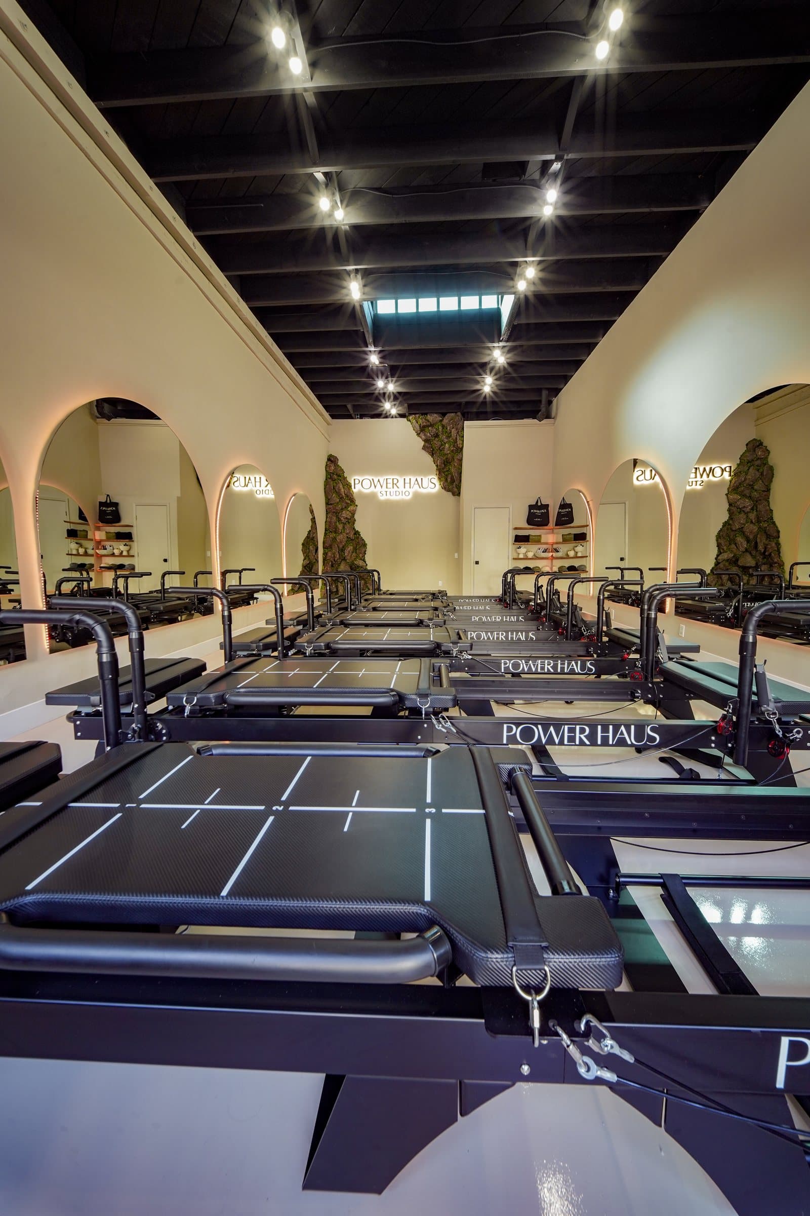 The Power Haus studio — reformers under the arched mirrors